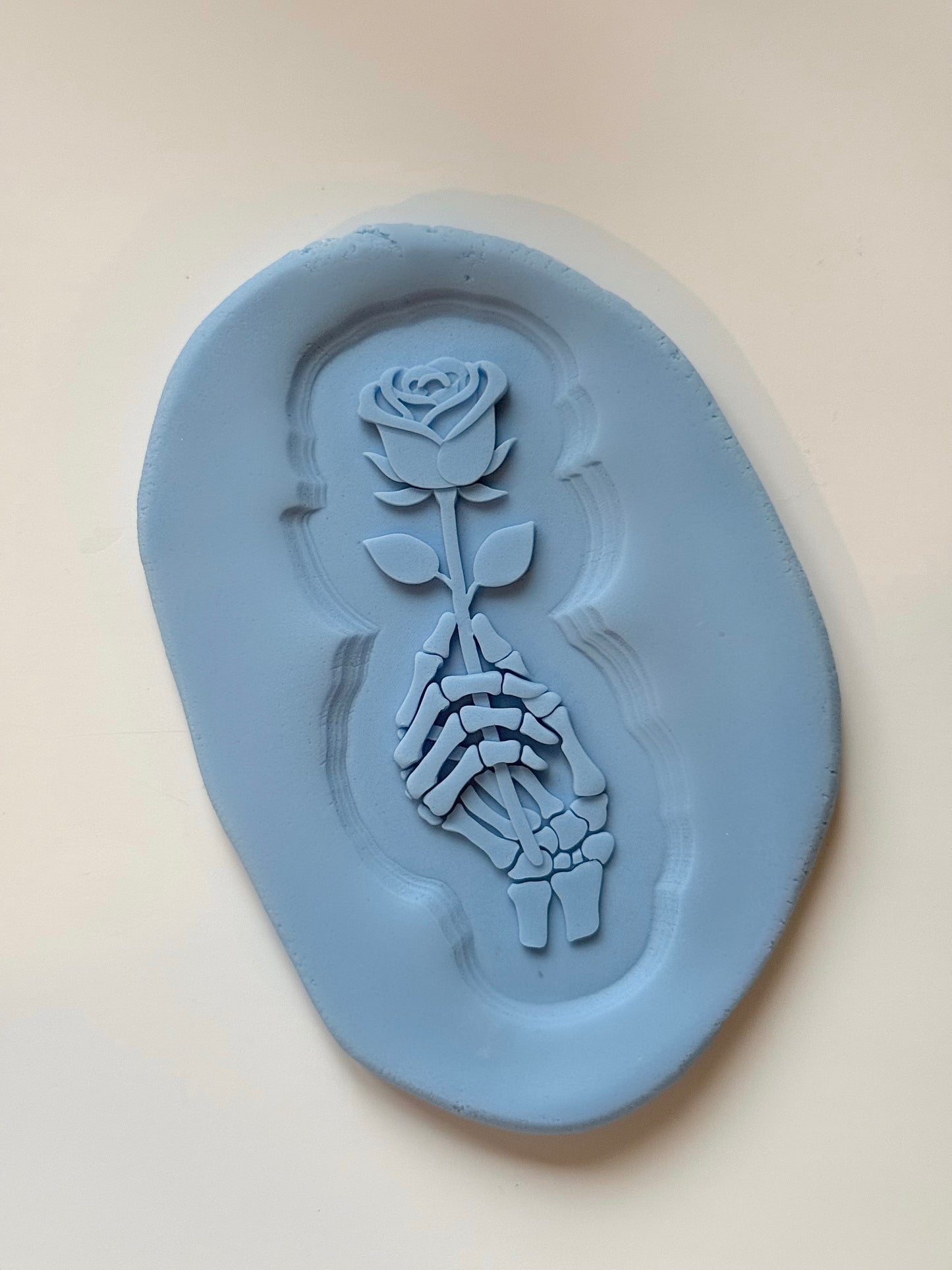 Skeleton Hand Holding Rose