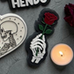 Skeleton Hand Holding Rose