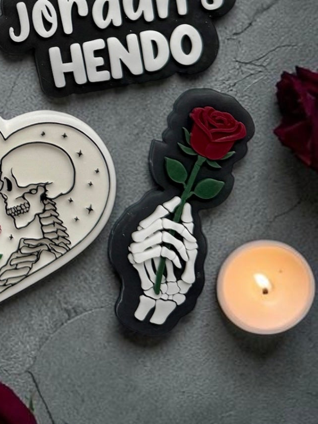 Skeleton Hand Holding Rose